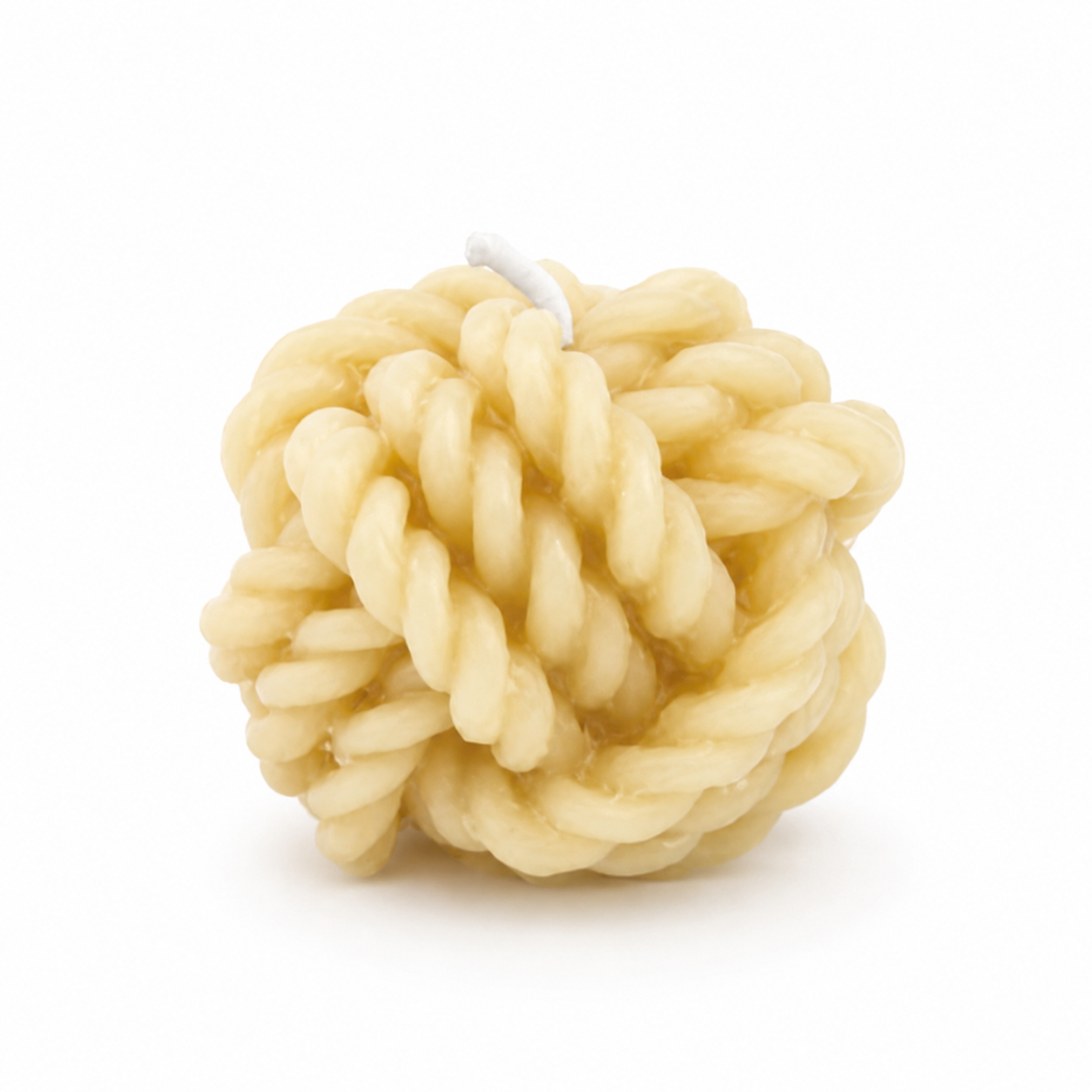 Set of three Serenes Beeswaxory pure beeswax rope ball candles arranged in a box, showcasing natural beeswax texture and warm glow.