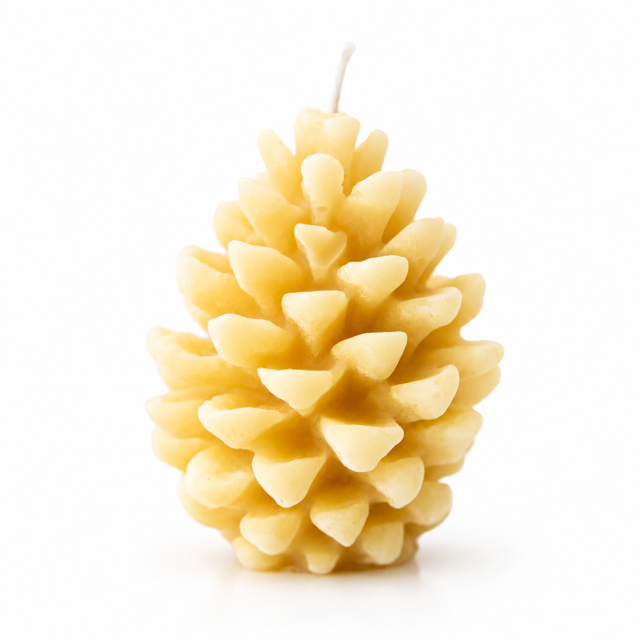 Serenes Beeswaxory pinecone design pure beeswax candles with natural pinecone shapes on a wooden surface.