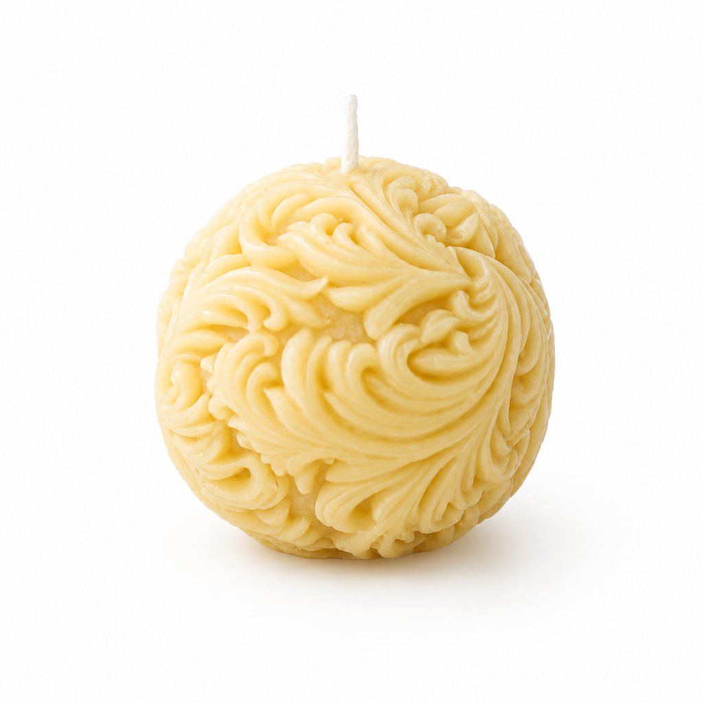 Serenes Beeswaxory Sphere Filigree Candles made of pure beeswax with intricate filigree design, glowing softly.