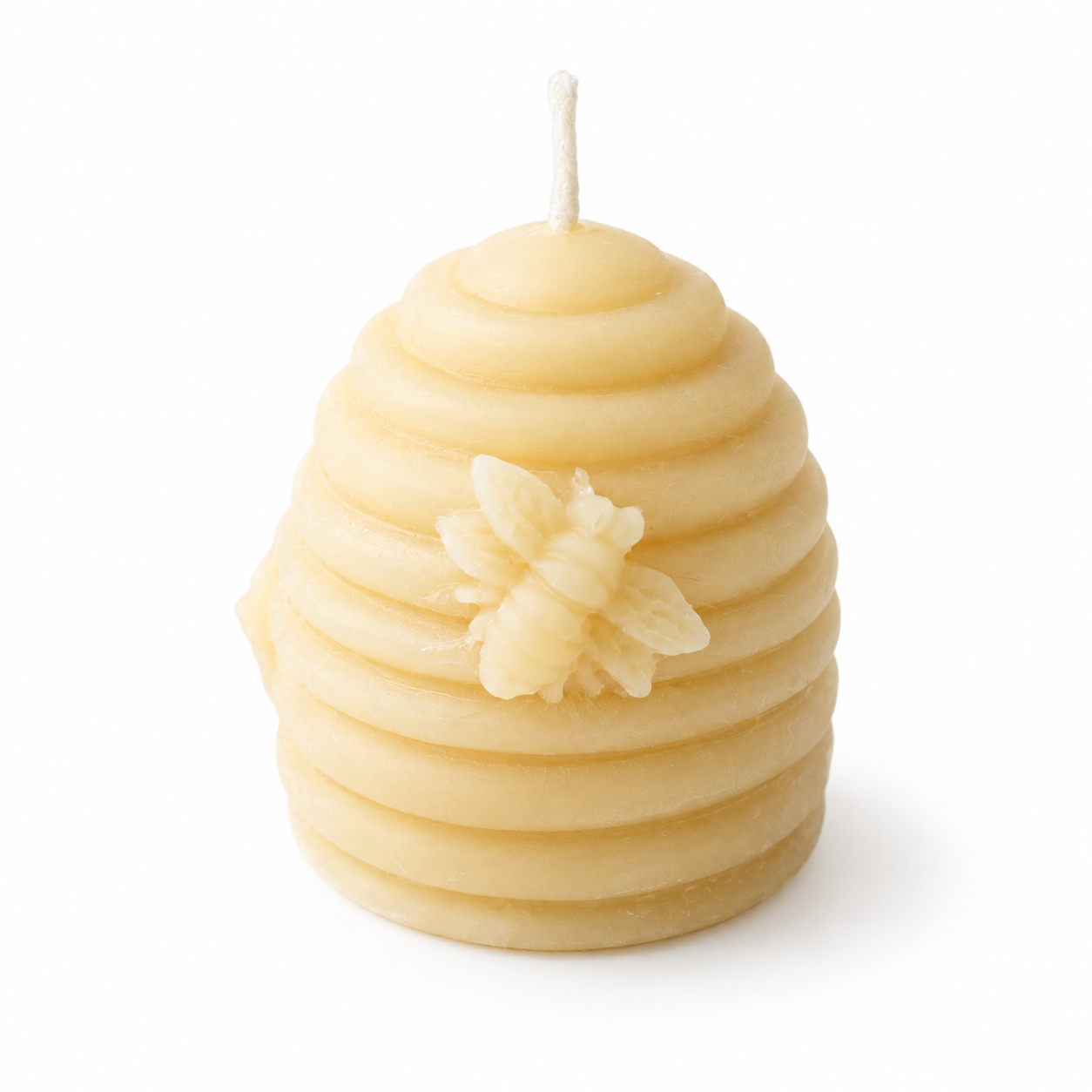 Set of four Serenes Beeswaxory pure beeswax votive candles in a beehive design box, perfect for ambient lighting and natural decor.