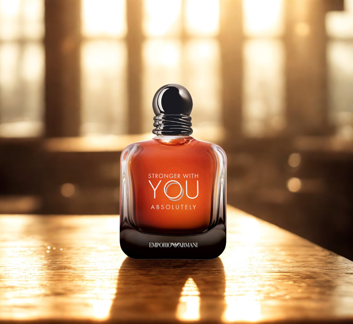 Perfume bottle with 'Stronger with You Absolutely' text on a wooden surface backlight with warm natural light 
