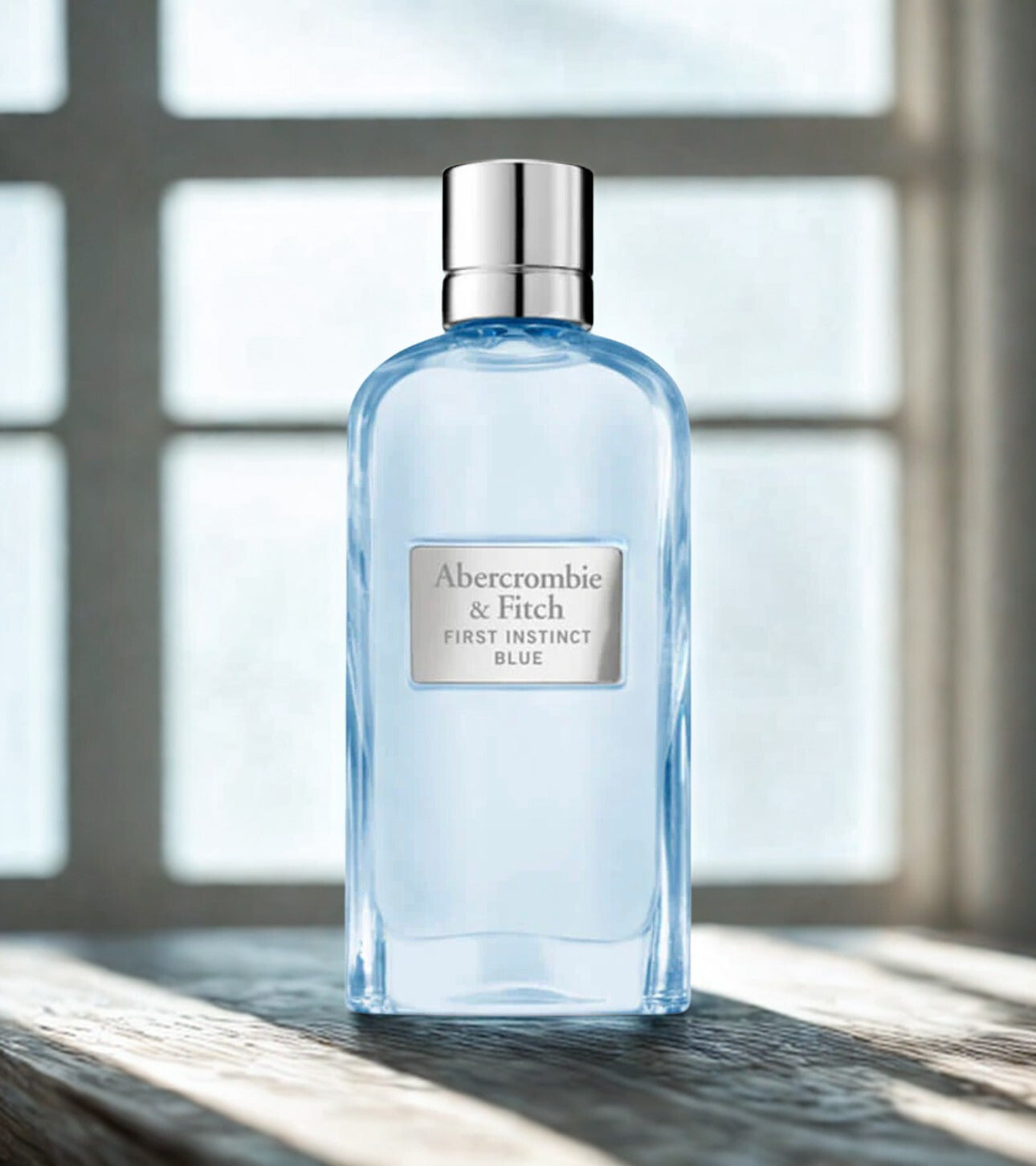 First Instinct Blue women’s 100ml Eau de Parfum by Abercrombie & Fitch, featuring the perfume bottle with a sleek blue design.
