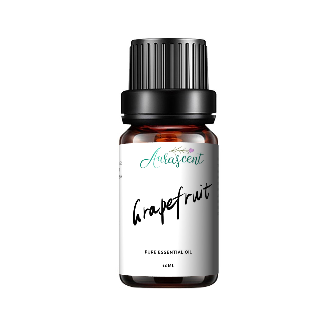 A 10ml bottle of Aurascent grapefruit essential oil with fresh grapefruit slices and botanical elements around the bottle.