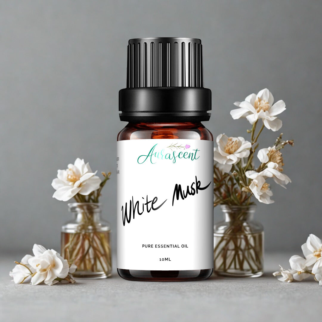 Aurascent White Musk fragrance oil in a 10ml bottle, featuring a clear glass container with white label and silver cap.