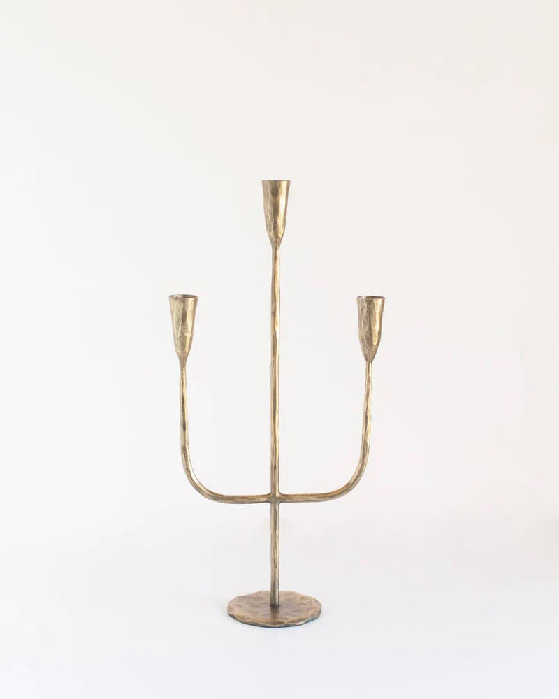 Hand forged iron candlestand with brass finish, decorative candelabra from Creative Women Australia, showcasing intricate craftsmanship.