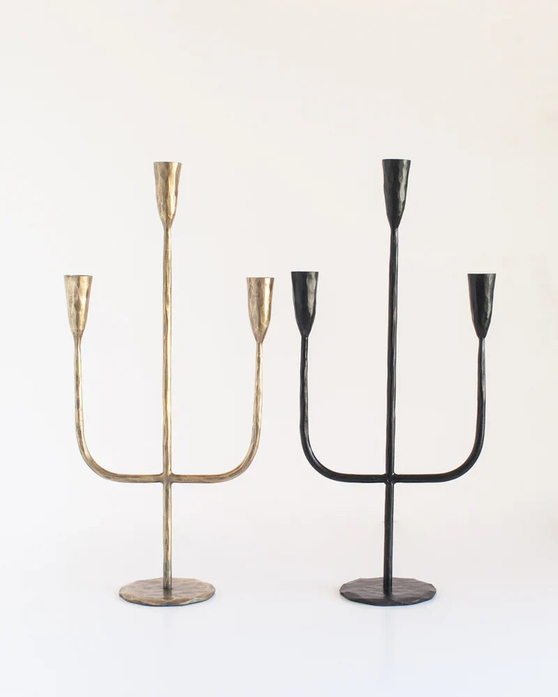 Hand-forged iron candlestick candelabra with brass finish by Creative Women Australia, showcasing a rustic, artisanal design.