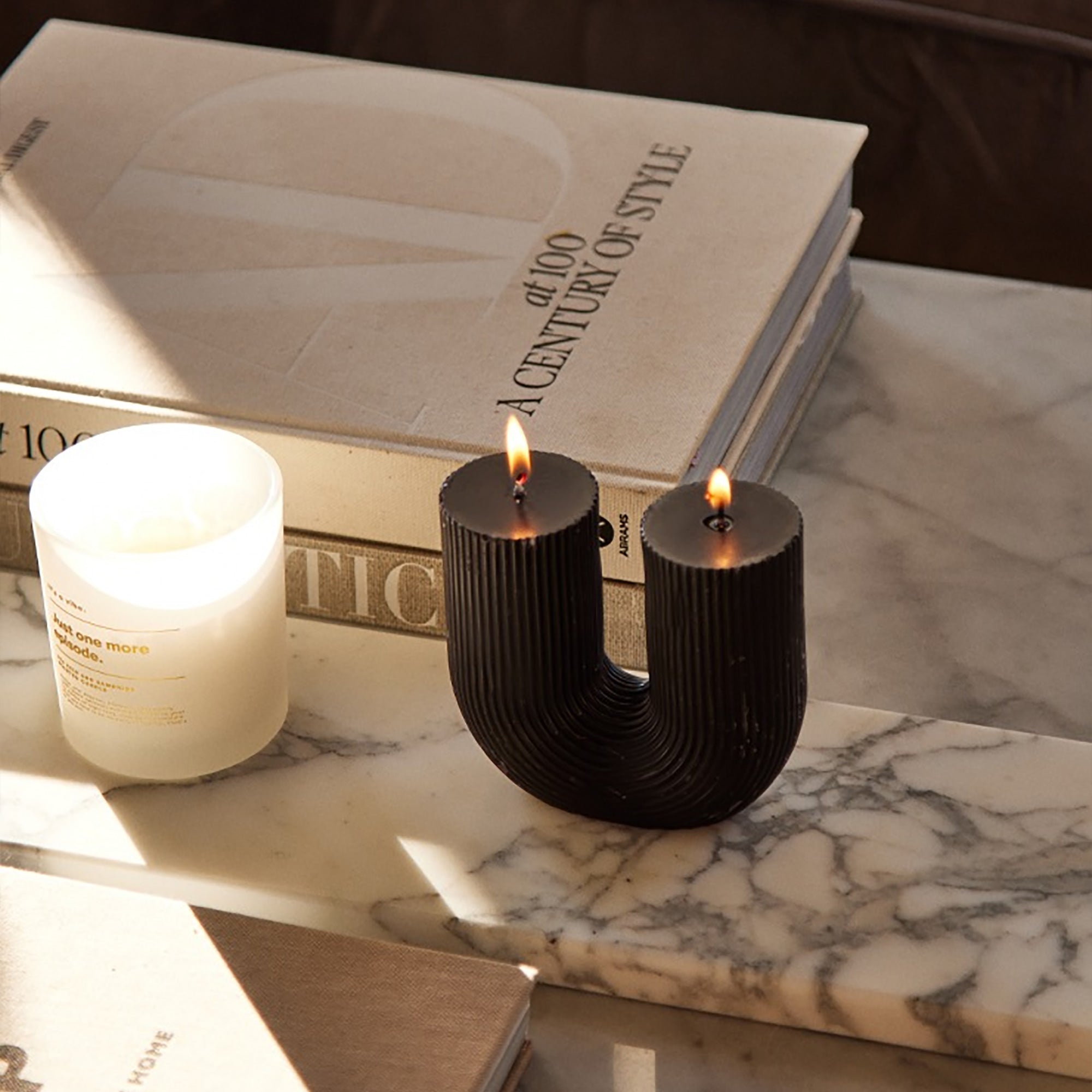 Black Cranberry Arch Candle by Escape to Paradise with a sleek black design and elegant arch shape.