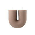 Escape to Paradise Arch Candle in Sea Salt & Caramel scent, showcasing the elegant design and warm glowing ambiance.