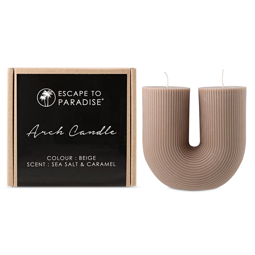Arch Candle by Escape to Paradise in Sea Salt & Caramel scent, featuring a sleek design and warm, inviting glow.