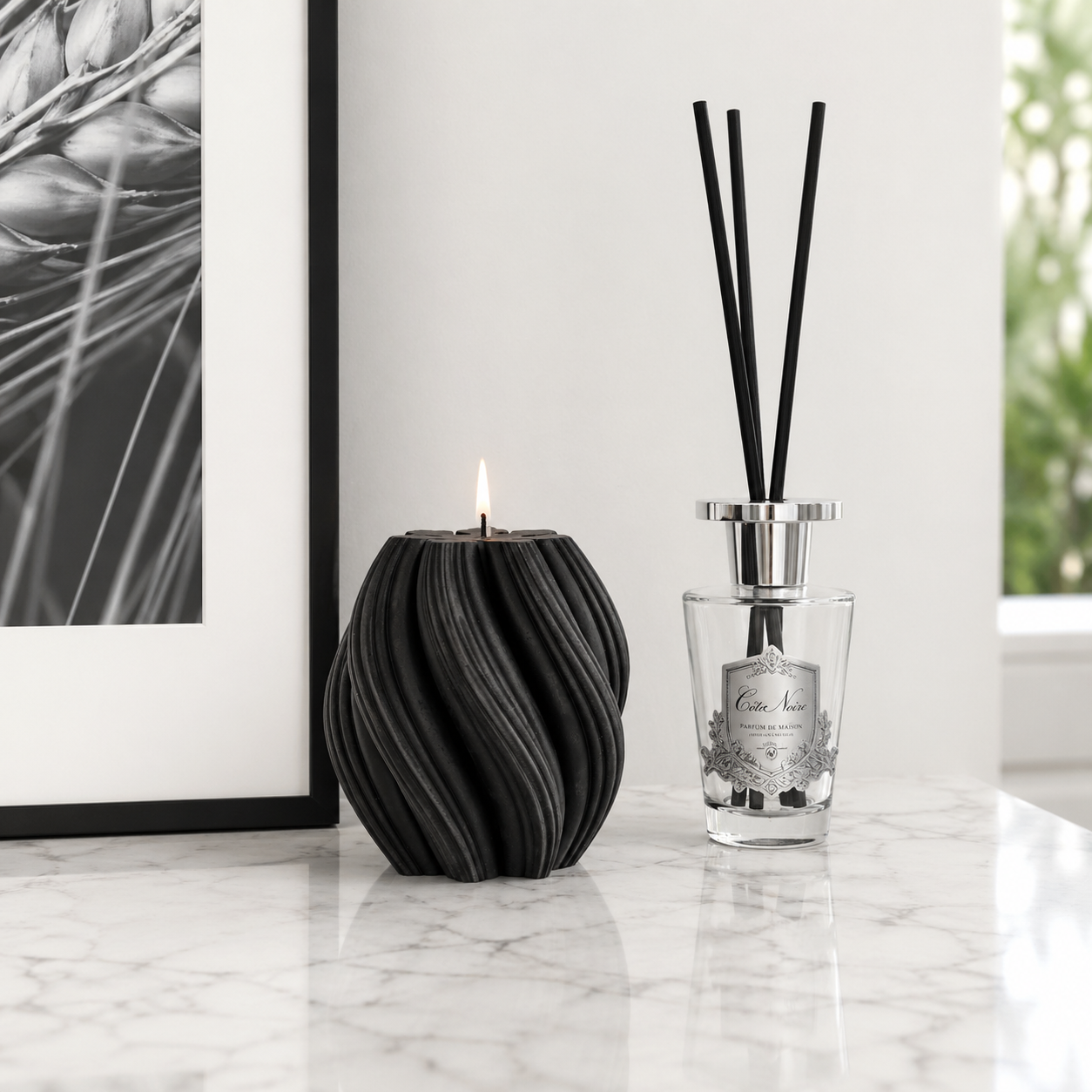 Black cranberry swirl candle by Escape to Paradise, showing a decorative candle with a swirling design and rich cranberry scent.