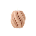 Swirl candle by Escape to Paradise featuring a vibrant orange blossom scent, with a decorative swirl design and warm glow.