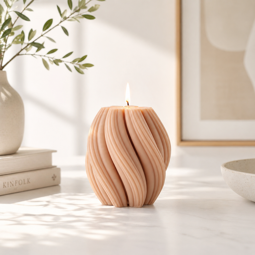 Swirl candle by Escape to Paradise with orange blossom scent, featuring a decorative orange and white swirled design.