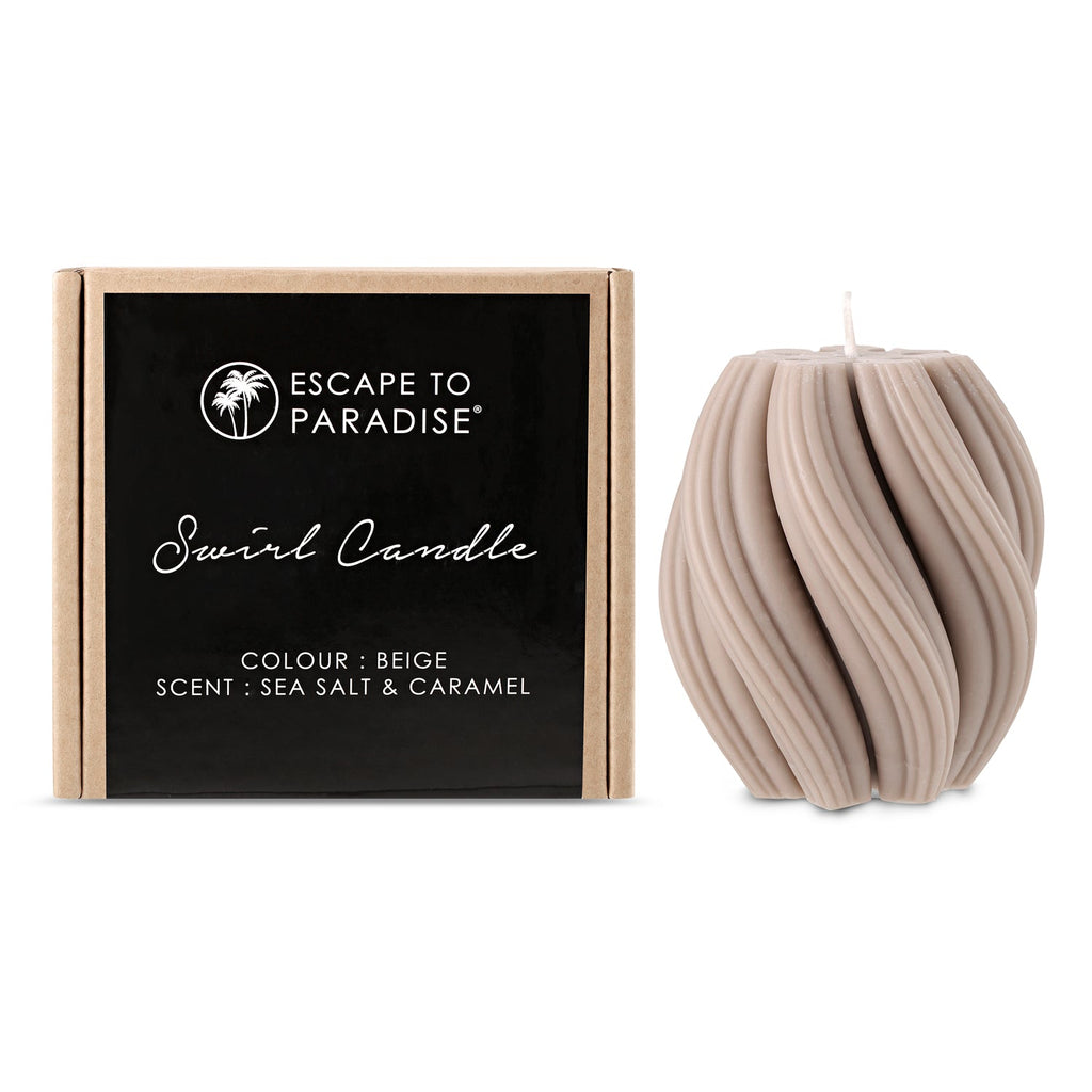 Swirl candle by Escape to Paradise featuring sea salt and caramel scent, with a decorative swirl design and warm glow.