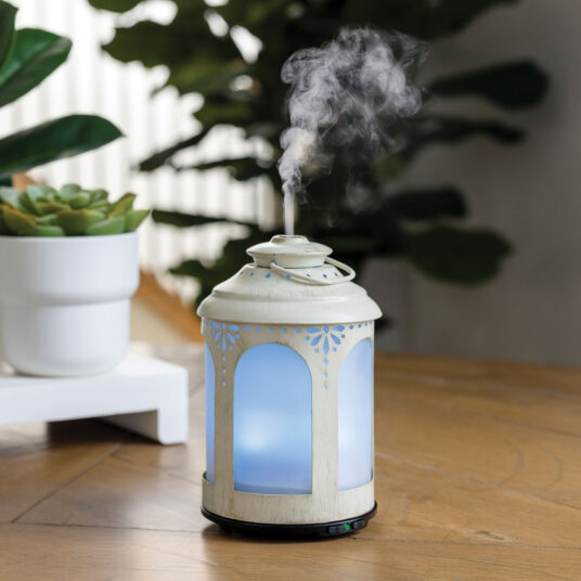 NNE Living Chelsea Lantern Ultrasonic Aroma Diffuser displaying a decorative lantern design and mist output in a modern setting.
