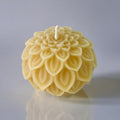 Pure beeswax ball candles with petal and dahlia flower designs from Serenes Beeswaxory, showcasing natural beeswax craftsmanship.