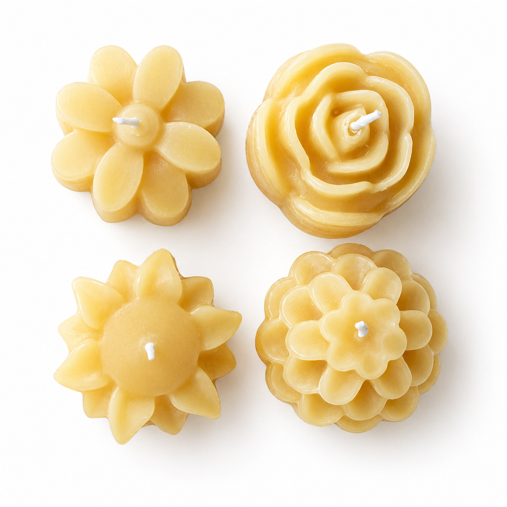 Set of four Serenes Beeswaxory flower-shaped pure beeswax tealight candles in a box, showcasing their natural yellow hue and delicate floral design.