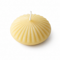 Six fluted tealight floating candles made of pure beeswax by Serenes Beeswaxory, shown in a box with a natural, textured finish.