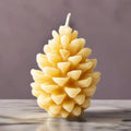Serenes Beeswaxory pinecone design pure beeswax candles with natural pinecone shapes, showcasing warm, handcrafted beeswax candle artistry.