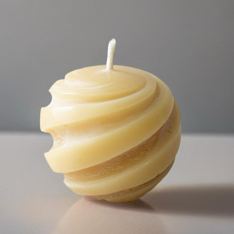 Box of three Serenes Beeswaxory Swirl Ball Candles made of pure beeswax, featuring a decorative swirl design.