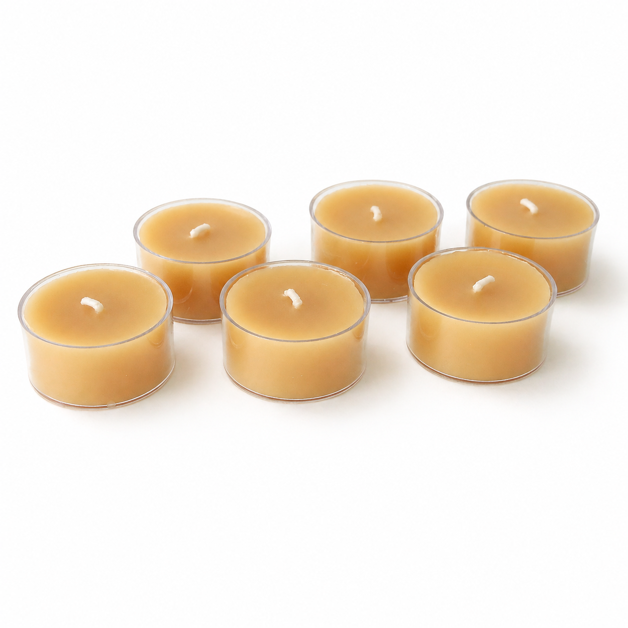 Set of six Serenes Beeswaxory pure beeswax tealight candles in a box, showcasing warm, natural beeswax textures and soft glow.