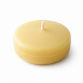 Six Serenes Beeswaxory pure beeswax tealight floating candles in a box, showcasing their warm, natural glow and smooth beeswax surface.