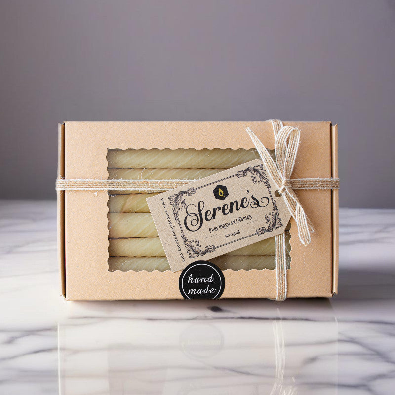 Box of 8 Serenes Beeswaxory Twirl Taper Candles made from pure beeswax, featuring a twisted design and natural candle appearance.