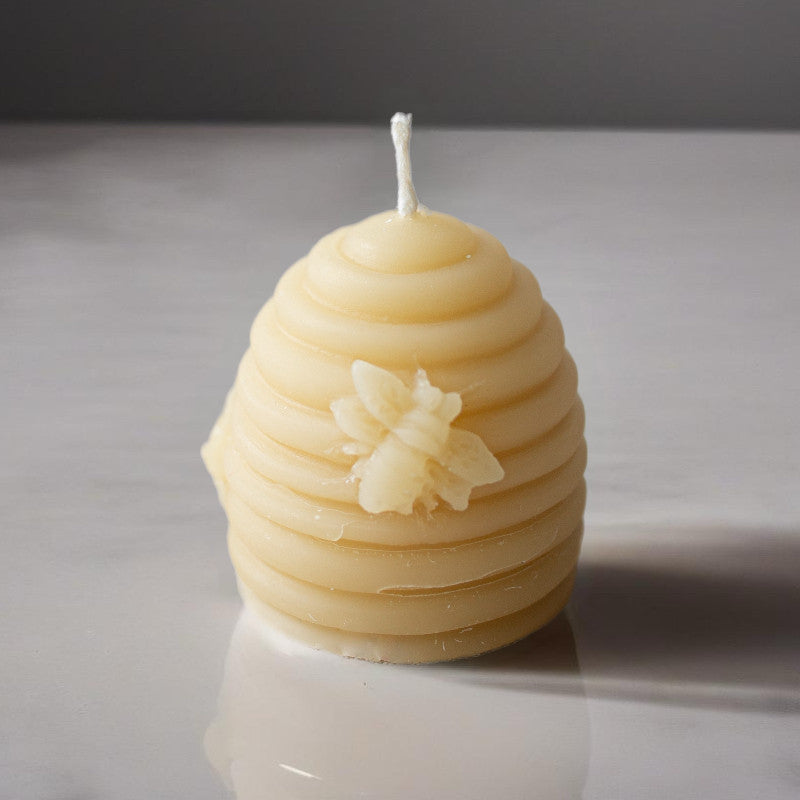 Set of four Serenes Beeswaxory votive candles in beehive-shaped pure beeswax, ideal for creating a warm, natural ambiance.